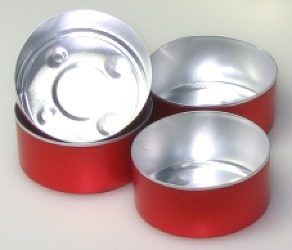 Several aluminum bowls for tea lights in red color